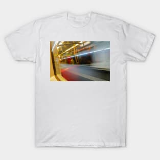 Commuters or passengers blurred in motion through window of passing train T-Shirt